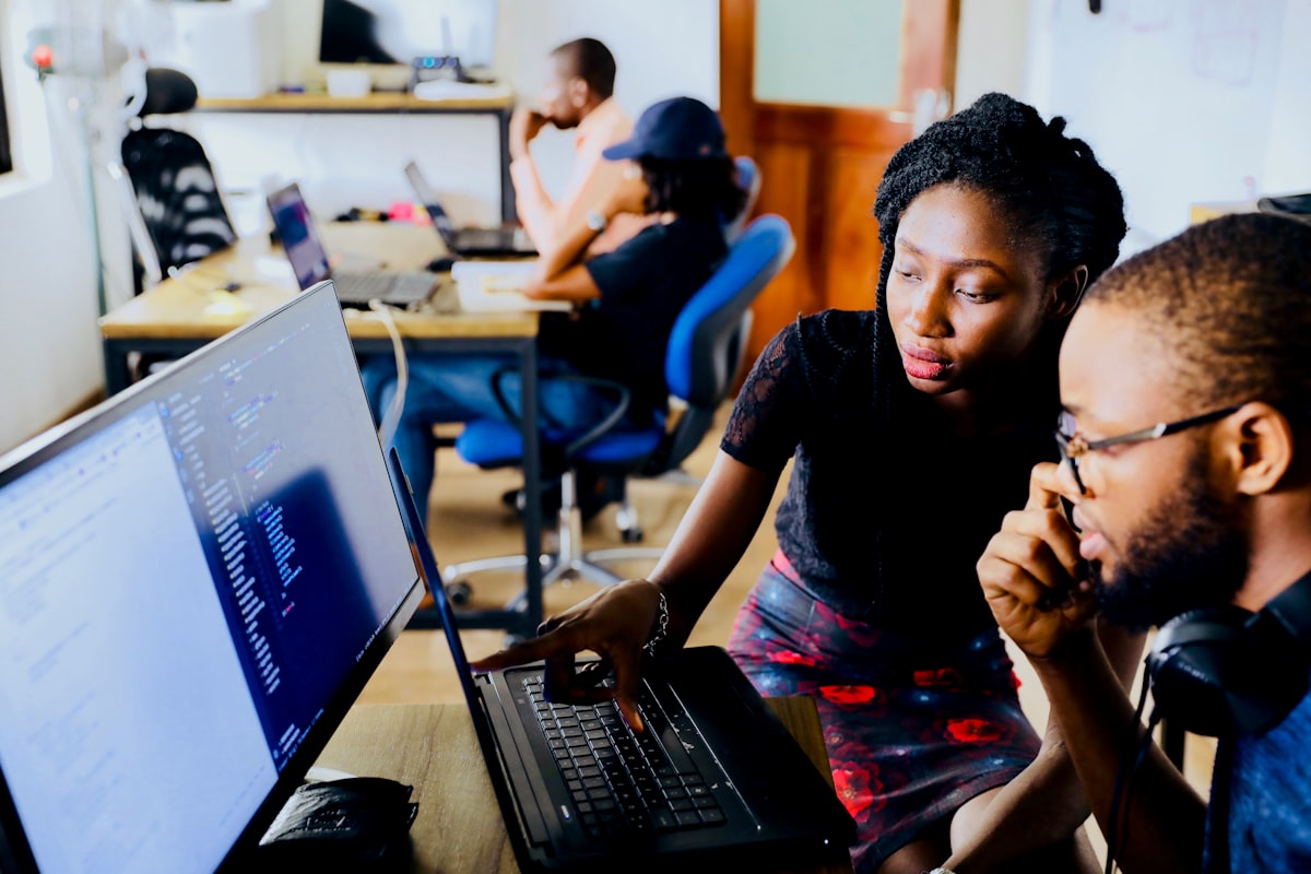 Engineers pair-programming on security tooling